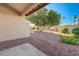 Low maintenance backyard area with trees and rock landscaping at 1850 Camino Verde Ln, Las Vegas, NV 89119
