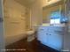 Well-lit bathroom featuring a shower-tub combo and a modern white vanity with chrome hardware at 1850 Camino Verde Ln, Las Vegas, NV 89119