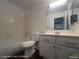 Clean bathroom featuring a shower-tub combo and a modern white vanity with chrome hardware at 1850 Camino Verde Ln, Las Vegas, NV 89119