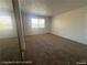 Bedroom featuring neutral carpet, and natural lighting at 1850 Camino Verde Ln, Las Vegas, NV 89119