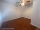 Bedroom with hardwood flooring, ceiling fan with light and neutral-colored walls at 1850 Camino Verde Ln, Las Vegas, NV 89119