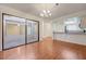 Open dining area with hardwood floors, sliding glass doors to the patio, and open access to the kitchen at 1850 Camino Verde Ln, Las Vegas, NV 89119