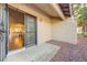 Private patio with view into open-concept kitchen featuring gleaming hardwood floors and modern finishes at 1850 Camino Verde Ln, Las Vegas, NV 89119