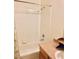 Bright bathroom features a tub/shower combo with tile surround and laminate vanity at 2121 Hussium Hills St # 107, Las Vegas, NV 89108