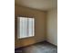 Bedroom view featuring carpeted floors and a window offering natural light at 2121 Hussium Hills St # 107, Las Vegas, NV 89108