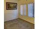 Carpeted bedroom featuring bright natural light and neutral walls with classic blinds at 2121 Hussium Hills St # 107, Las Vegas, NV 89108
