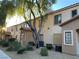 Exterior view of a multi-Gathering residential building with well-maintained landscaping and mature trees at 2121 Hussium Hills St # 107, Las Vegas, NV 89108