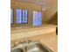 Kitchen features laminate countertops, stainless sink, and views of the exterior at 2121 Hussium Hills St # 107, Las Vegas, NV 89108