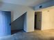 The open-concept living room welcomes you with fresh paint and new carpet at 2121 Hussium Hills St # 107, Las Vegas, NV 89108