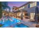 Beautiful backyard with pool, spa, outdoor dining, and lush landscaping at 2240 Boutique Ave, Henderson, NV 89044
