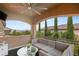 Comfortable covered balcony with scenic views, stylish seating, and ceiling fan at 2240 Boutique Ave, Henderson, NV 89044