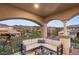 Relaxing covered balcony with cozy seating and beautiful views of the surrounding neighborhood at 2240 Boutique Ave, Henderson, NV 89044