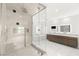 Bright bathroom featuring a spacious glass shower and double vanity with modern fixtures at 2240 Boutique Ave, Henderson, NV 89044