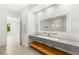 Modern bathroom featuring dual vanity with vessel sinks and a view to the pool at 2240 Boutique Ave, Henderson, NV 89044