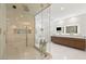 Luxurious bathroom with a glass shower, soaking tub, and marble floors at 2240 Boutique Ave, Henderson, NV 89044