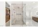 Modern bathroom showcasing a glass shower, freestanding tub, and custom-designed vanity at 2240 Boutique Ave, Henderson, NV 89044