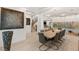 Stylish dining room featuring modern decor, a large table, and a glass-enclosed wine cellar at 2240 Boutique Ave, Henderson, NV 89044