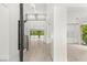 Bright foyer with wood floors, stairs, and clear views to the backyard oasis and pool at 2240 Boutique Ave, Henderson, NV 89044