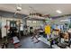 A home gym in a garage with a weight rack, bench, and stationary bicycle equipment at 2240 Boutique Ave, Henderson, NV 89044