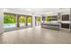Spacious living area flows into a modern kitchen and offers views of the outdoor pool area at 2240 Boutique Ave, Henderson, NV 89044