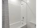 Bathtub and shower combination featuring white tiling at 25 Barbara Ln # 36, Las Vegas, NV 89183
