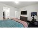 Bedroom with a TV, a dresser, and an exercise bike, providing comfort and fitness at 25 Barbara Ln # 36, Las Vegas, NV 89183