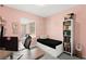 Bedroom featuring pink walls, a built in bed, and a dedicated workspace at 25 Barbara Ln # 36, Las Vegas, NV 89183