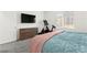 Bedroom with TV, dresser, and exercise bike, providing comfort and fitness at 25 Barbara Ln # 36, Las Vegas, NV 89183