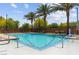 Outdoor pool area surrounded by lush landscaping and shaded seating, perfect for relaxation at 25 Barbara Ln # 36, Las Vegas, NV 89183