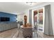 Bright dining area with stylish table, seating, and sliding glass door to outdoor view at 25 Barbara Ln # 36, Las Vegas, NV 89183