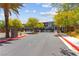Gated community entrance with lush landscaping and decorative stone accents at 25 Barbara Ln # 36, Las Vegas, NV 89183