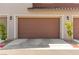 Spacious two-car garage offers ample parking and storage with carriage doors at 25 Barbara Ln # 36, Las Vegas, NV 89183