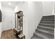 Well-lit entryway with staircase, shelving, and storage for shoes and accessories at 25 Barbara Ln # 36, Las Vegas, NV 89183