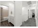 Bright hallway featuring a bathroom and exercise equipment room at 25 Barbara Ln # 36, Las Vegas, NV 89183
