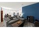View of the living room flowing into a bright kitchen with modern white cabinets at 25 Barbara Ln # 36, Las Vegas, NV 89183