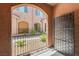 Private covered patio featuring decorative metal screen, providing a stylish outdoor living space with courtyard view at 25 Barbara Ln # 36, Las Vegas, NV 89183