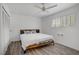 Bright bedroom with wood-look flooring, a queen-sized bed, and natural light at 2706 Colanthe Ave, Las Vegas, NV 89102