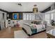 A spacious bedroom with an exercise bike, tile flooring, and ample natural light at 2706 Colanthe Ave, Las Vegas, NV 89102