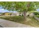 Charming single-story home with a large, mature tree in the front yard and an inviting exterior at 2706 Colanthe Ave, Las Vegas, NV 89102