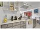 The kitchen featuring white ceiling, gray cabinets and white appliances at 2706 Colanthe Ave, Las Vegas, NV 89102
