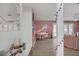Open floor plan with pink walls, light tile floors, and bright, airy space at 2706 Colanthe Ave, Las Vegas, NV 89102