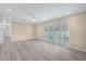 Bright, open living room featuring neutral tones, modern ceiling fan, and sliding glass doors at 2706 Colanthe Ave, Las Vegas, NV 89102