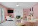 Charming living area with pink walls, fireplace, modern decor, and lots of light at 2706 Colanthe Ave, Las Vegas, NV 89102