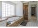 Spa-like bathroom with a soaking tub, marble accents, and a separate shower at 271 E Shelbourne Ave, Las Vegas, NV 89123