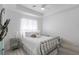 Well-lit bedroom with a modern design, light wood-look floors, and neutral decor at 271 E Shelbourne Ave, Las Vegas, NV 89123