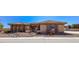 Charming single-story home displaying a stone-accented facade, a walkway, and desert-style landscaping at 271 E Shelbourne Ave, Las Vegas, NV 89123