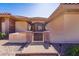 Close up of front gated entrance with stone pillars and decorative lighting at 271 E Shelbourne Ave, Las Vegas, NV 89123