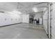 Expansive three-car garage with epoxy floors and storage cabinets at 271 E Shelbourne Ave, Las Vegas, NV 89123