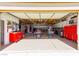 This spacious garage has ample room for vehicles, storage, and workspace with tools, workbenches and decor at 271 E Shelbourne Ave, Las Vegas, NV 89123