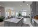 Bright, modern kitchen boasts an island, stainless appliances, and connects to the living area at 271 E Shelbourne Ave, Las Vegas, NV 89123